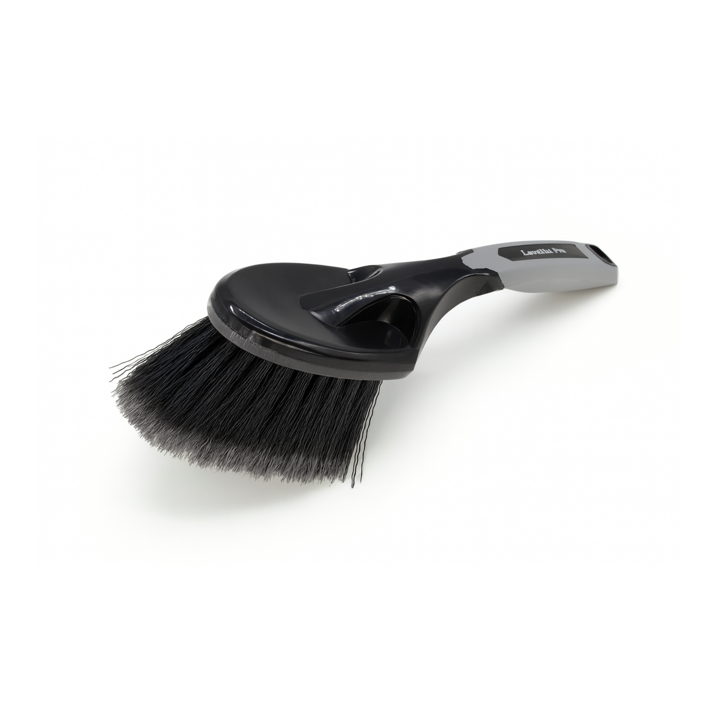 Black brush with a handle on a white background