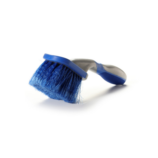 Blue brush with bristles on a white background