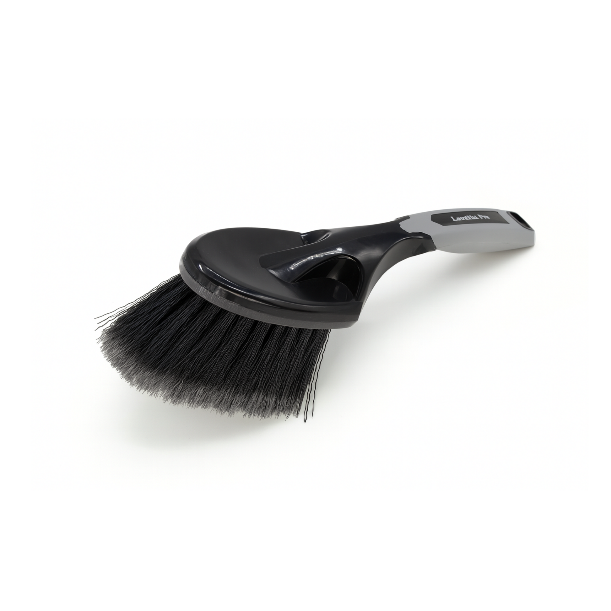 Black brush with a handle on a white background